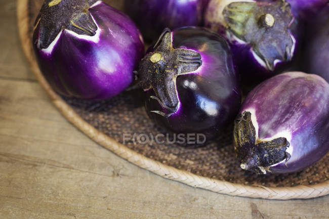 High angle close-up of a selection of fresh purple aubergines in a farm shop. — Stock Photo