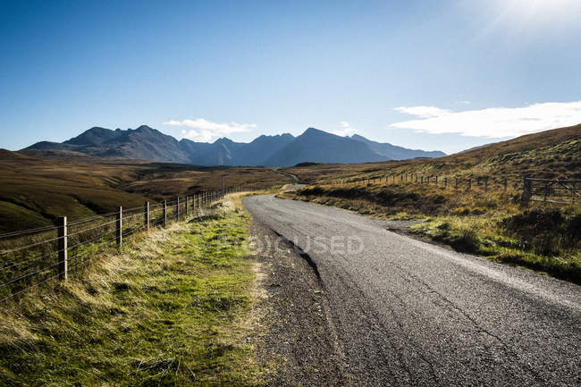 Landscape with rural road hills and mountains in distance, Western Highlands, Scotland, UK — Stock Photo