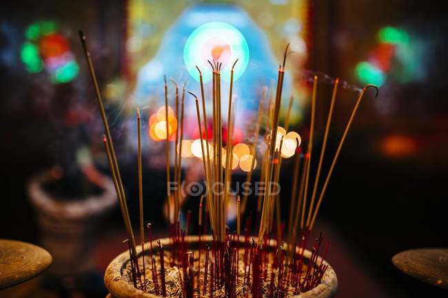 High angle close-up of incense at Asian temple. — Stock Photo