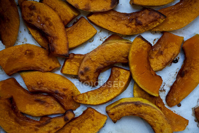 High angle close up of roasted apple slices in an artisan bakery. — Stock Photo