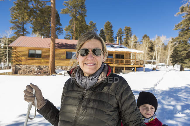 Portrait of mother and her young son outdoors in snow — Stock Photo