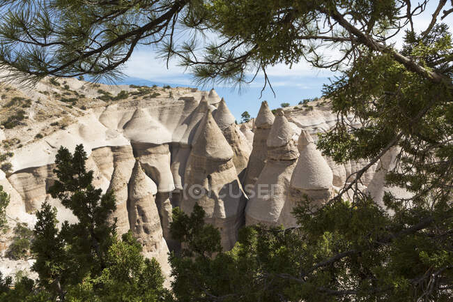Slot canyon at Kasha Katuwe and view across to the Tent Rocks and rows of eroded rock pillars. — Stock Photo