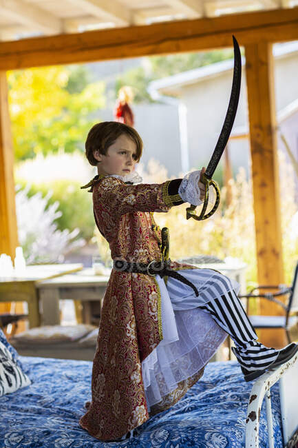 Portrait of cute seven year old boy dressed as a pirate — Stock Photo