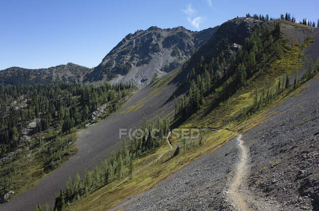 View over a valley and mountain path of the Pacific Crest Trail — Stock Photo