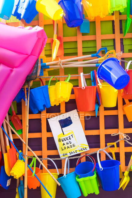 Bucket and spades and other beach items for sale, holiday resort, England — Stock Photo