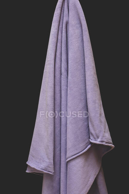 Close up of draped purple fleece fabric, focus on folds and creases — Stock Photo