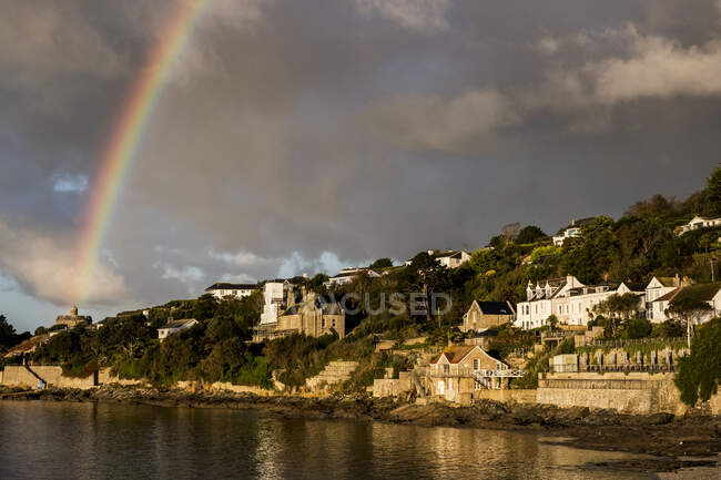 Cloudy sky with rainbow over Saint Mawes, Cornwall, UK. — Stock Photo