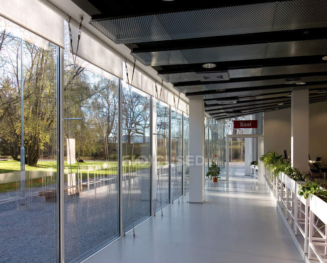 Lobby of hotel or conference centre with glass walls. — Stock Photo