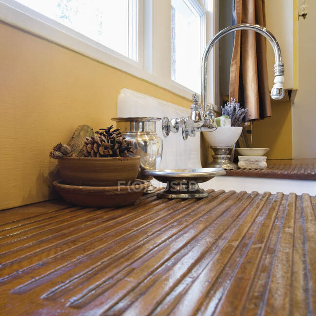 Wooden draining board and kitchen sink. — Stock Photo