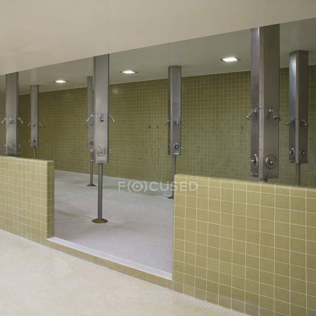 Showers in public wash room. — Stock Photo