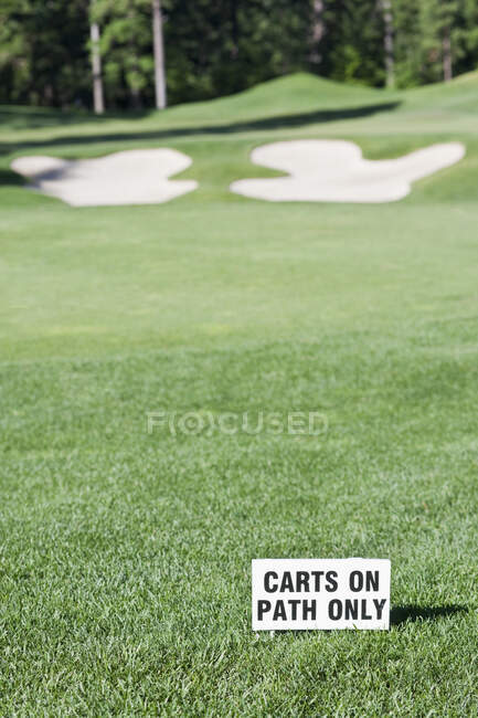 Golf green and sand bunker on golf course — Stock Photo