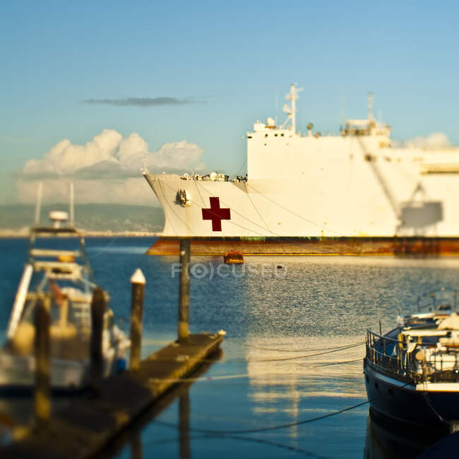Red cross ship in harbour — Stock Photo