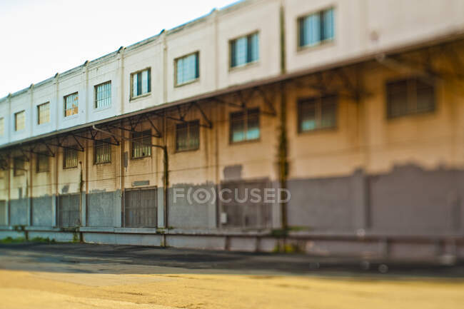 Old warehouse building with broken windows. — Stock Photo