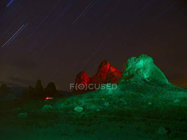 Lit up rock formations at night. — Stock Photo