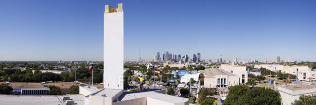A city skyline from a distance, rooftops — Stock Photo