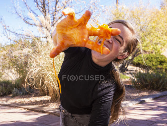 Teenage girl with pumpkin on her fingers. — Stock Photo