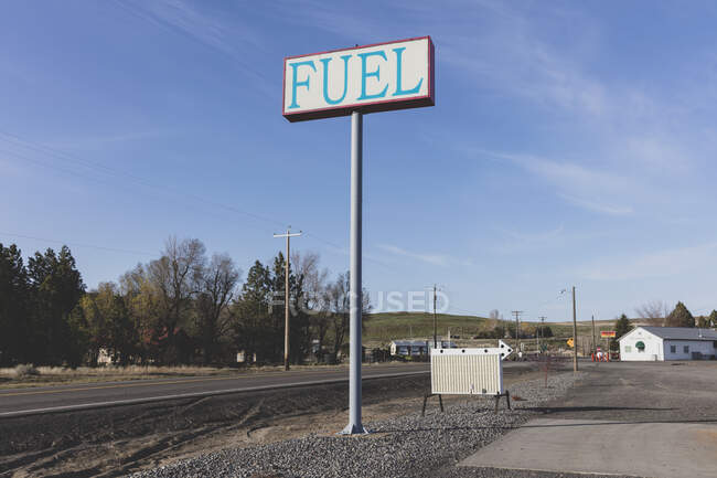 Fuel sign for rural gas station in a small town. — Foto stock