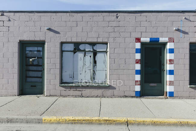 Entrance of abandoned barber shop — Stock Photo