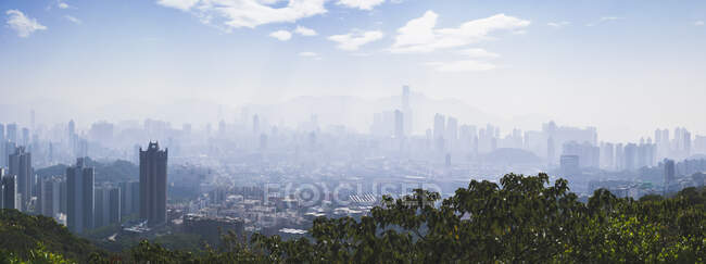 Hong Kong city seen in fog or mist. — Stock Photo