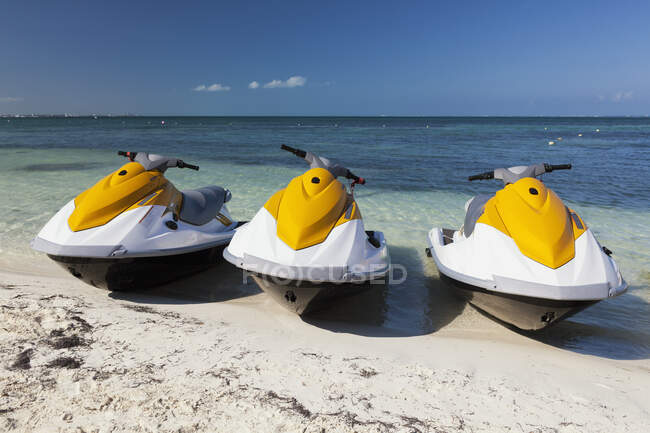 Three jet skis on the beach — Foto stock