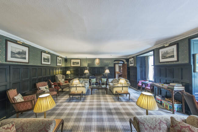 Hotel lounge with Scottish themed decoration, including tartan carpet. — Stock Photo