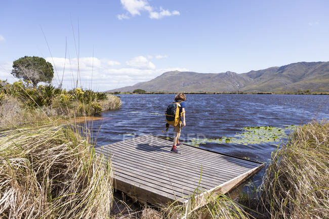 Young boy on boat launch, Stanford Valley Guest Farm, Stanford, Western Cape, South Africa. — Stockfoto