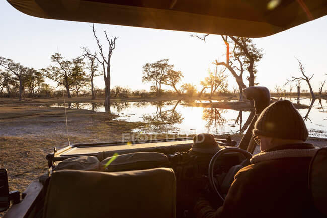 Alba sull'acqua, Delta dell'Okavango, Botswana — Foto stock