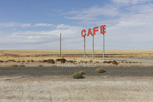 Large CAFE sign over rural farmland. — Fotografia de Stock