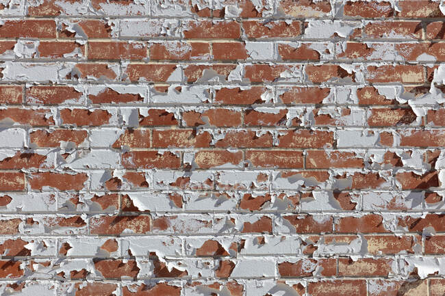 Peeling paint on old brick wall. — Stock Photo