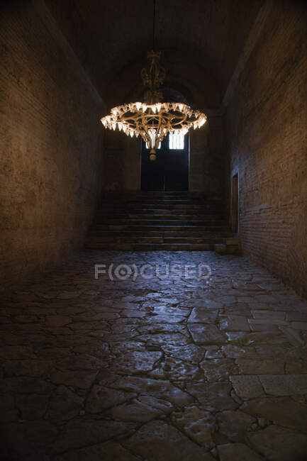 Hagia Sophia Grand Mosque, the dark interior of a historic building, former mosque and church, flagstones and chandeliers with bright lights. — Stock Photo