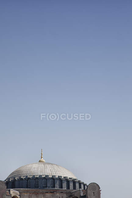 Istanbul, view of a historic building, a dome and a gold colour roof finial. — Stock Photo