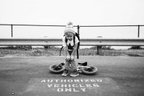 Boy reading inscription on asphalt — Stock Photo