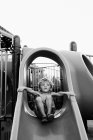 Boy sliding down on slide — Stock Photo