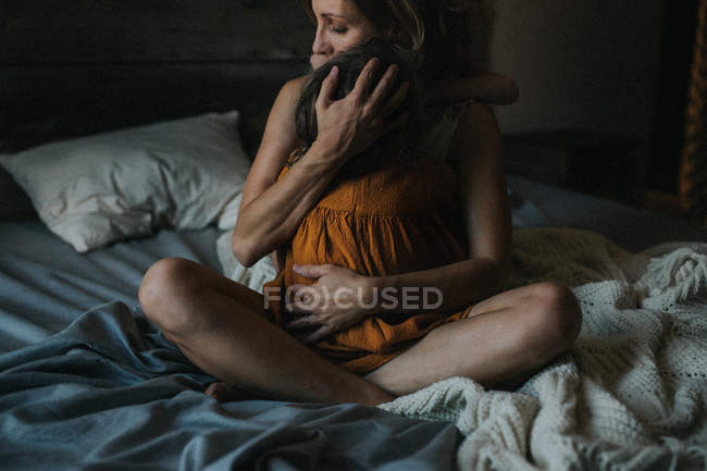 Mother hugging her child — Stock Photo