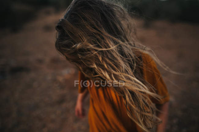 Girl with wind tousled hair — Stock Photo