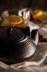 Stylish teapot and cup of tea — Stock Photo