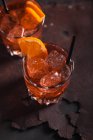 Glasses of vermouth with ice and orange — Stock Photo