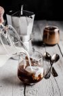 Coffee with ice on table — Stock Photo