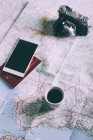 Smartphone, passport, cup of coffee — Stock Photo