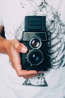 Vintage camera in hand — Stock Photo