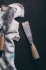 Shabby spatulas with dirty cloth — Stock Photo