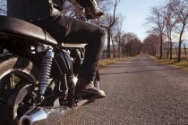 Partialview of motorcycle and man — Stock Photo