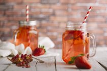 Strawberry smoothie in Mason jars — Stock Photo