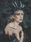 Mysterious woman with demon horns — Stock Photo