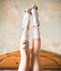 Woman legs in roller skates with pair of eyes — Stock Photo