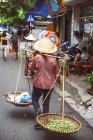 Vietnamese street market seller — Stock Photo