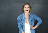 Young blonde girl in denim jacket — Stock Photo