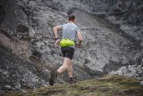 Man running cross country — Stock Photo