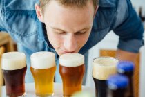 Man smelling craft beer — Stock Photo