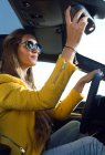 Young woman driving car. — Stock Photo